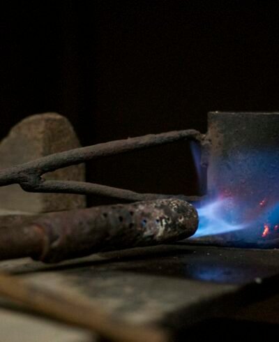 Blue torch flame on metal