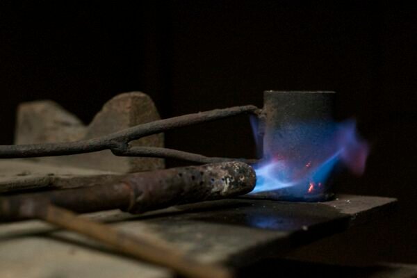 brazing-torch-flame Blue torch flame on metal