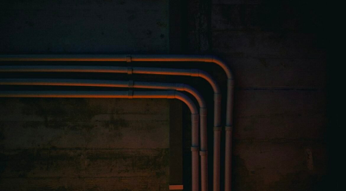 Copper pipework and fittings on a wall