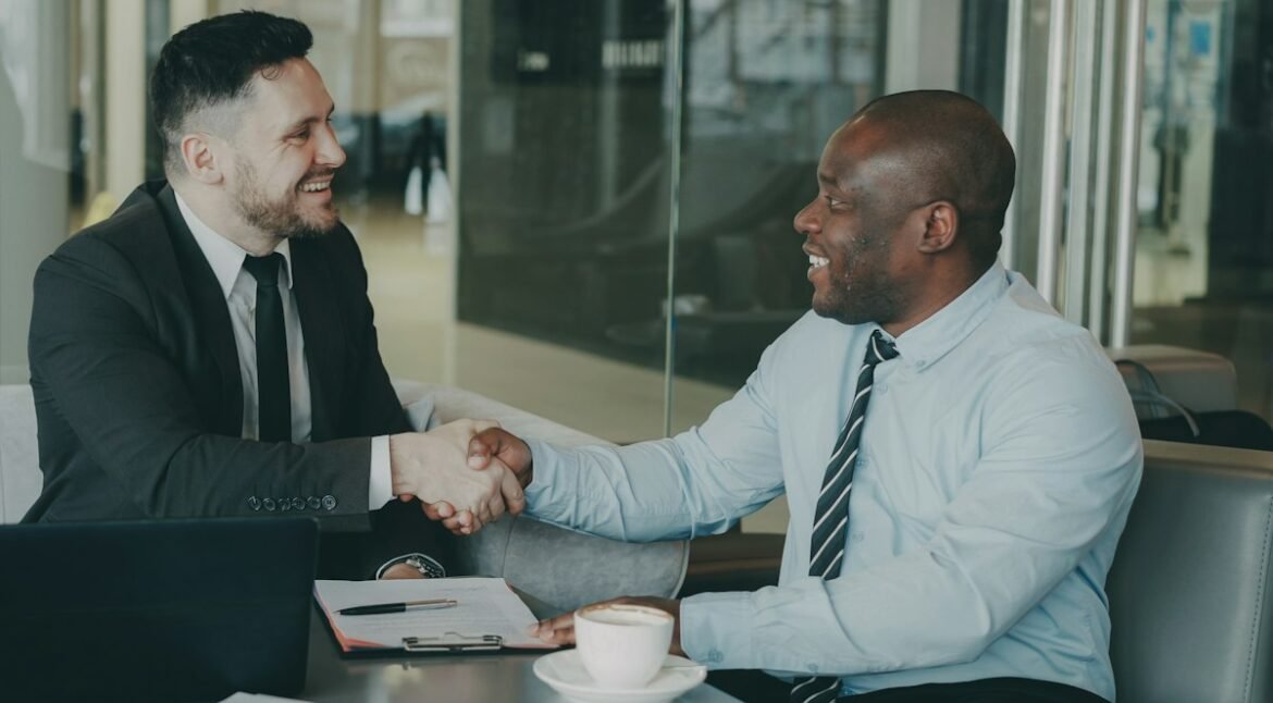 Two business people shaking hands